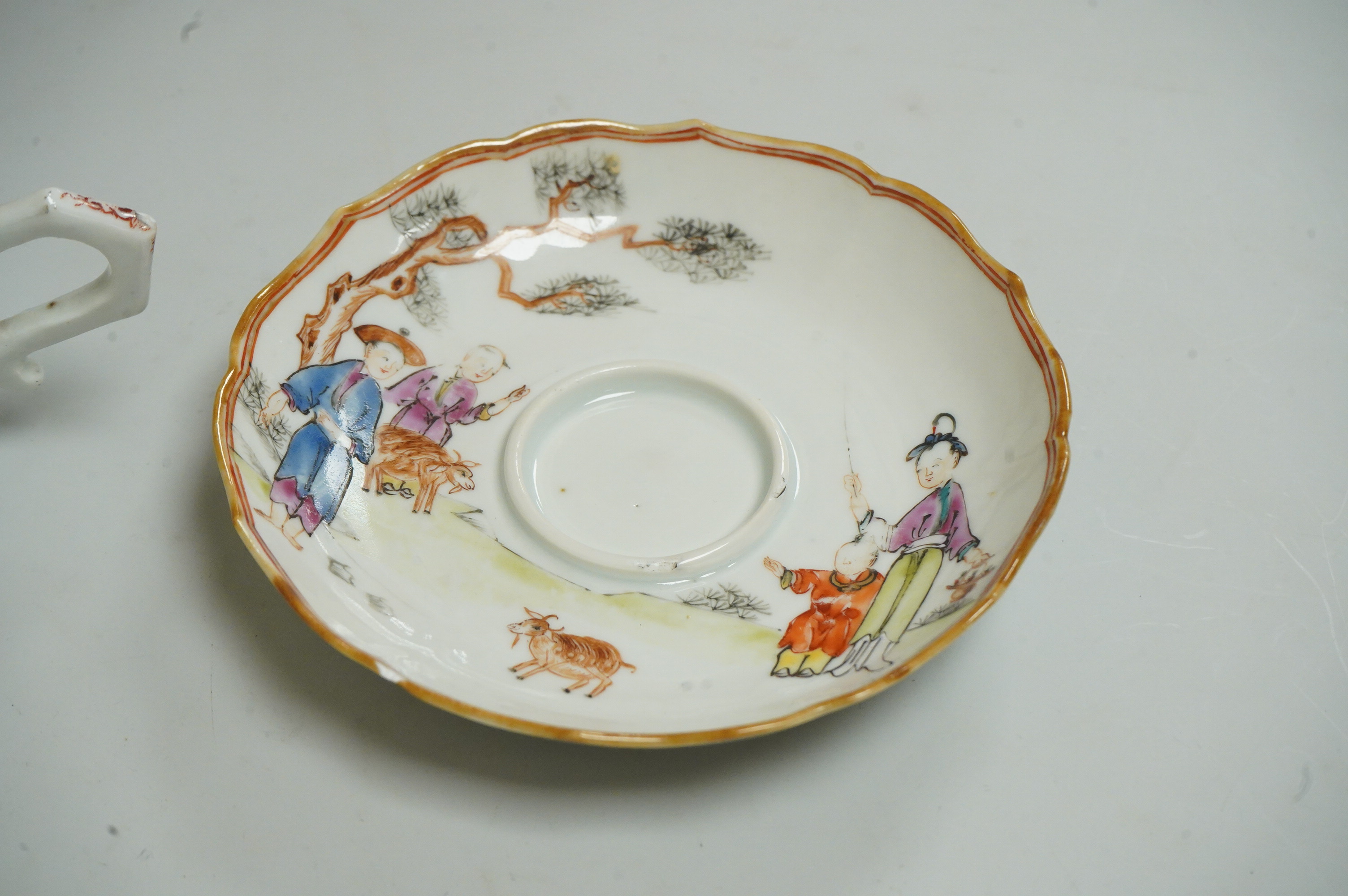 A Chinese export famille rose chocolate cup and trembleuse saucer, Qianlong period, saucer 13cm in diameter